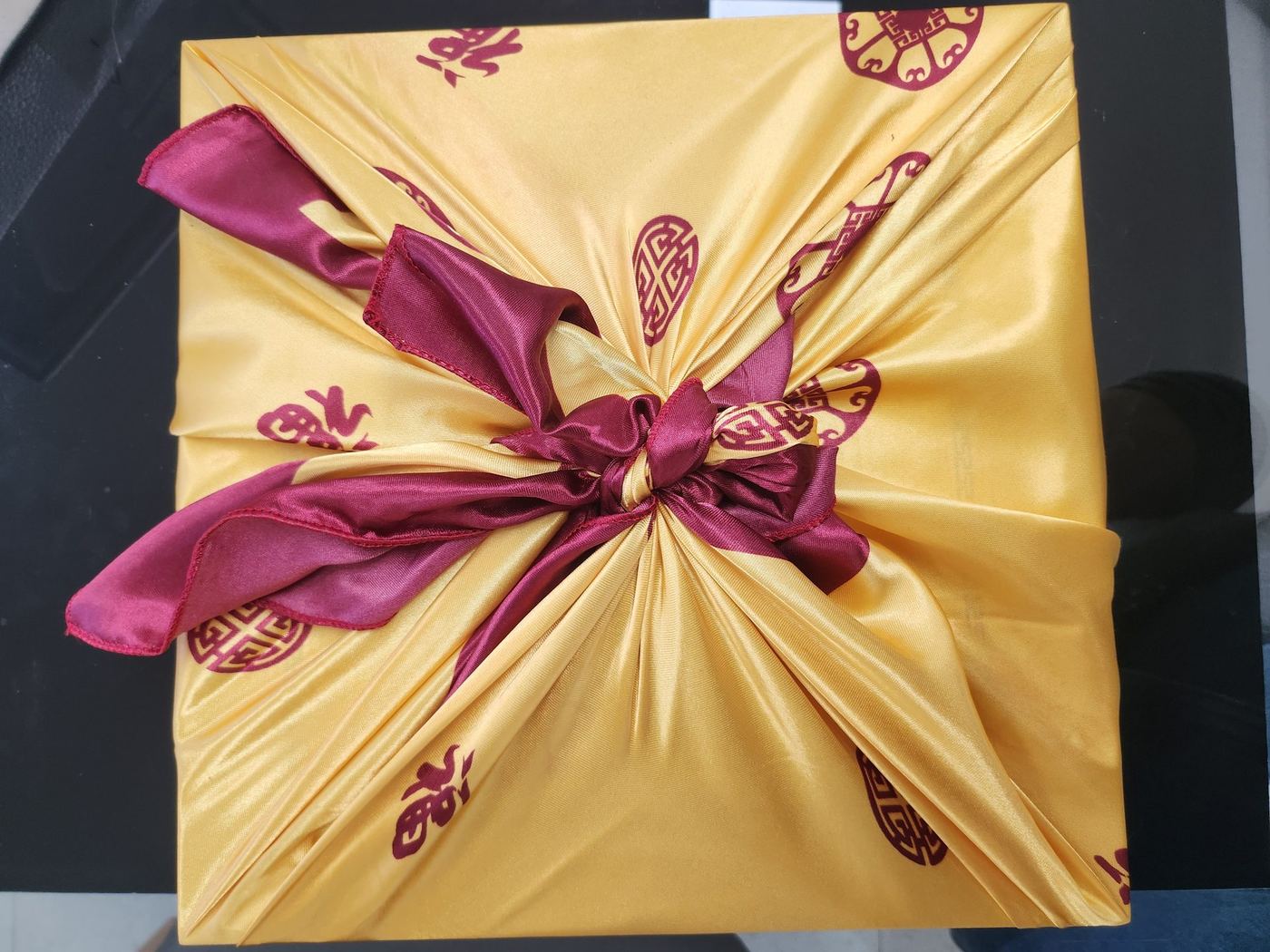 luxury ceramic jars of fermented ginseng paste on a dark textured background